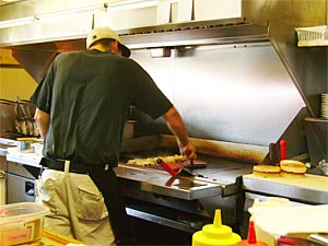 Onion burgers cooking at Sid's Diner